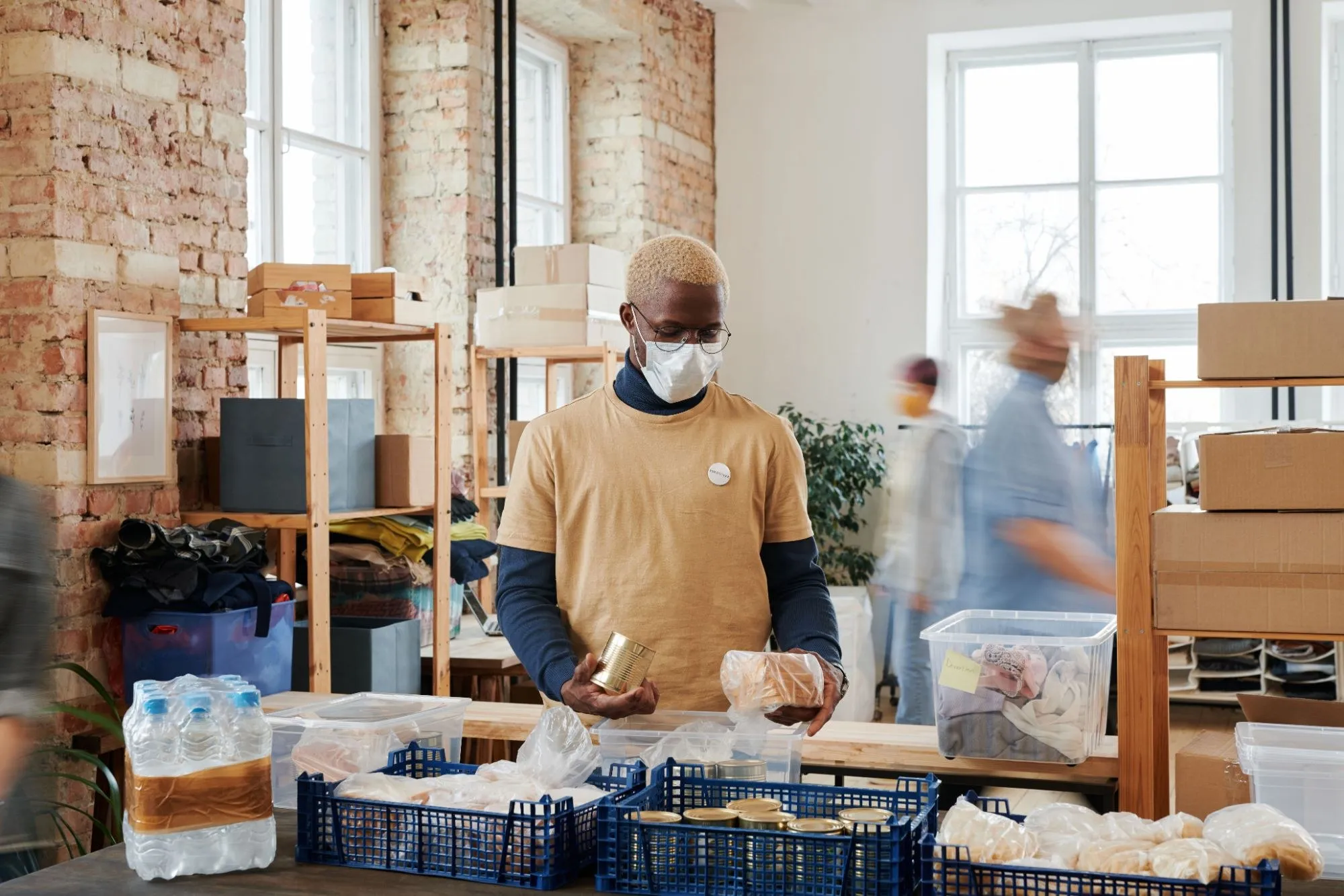 A volunteer sorting food donations at a community food bank